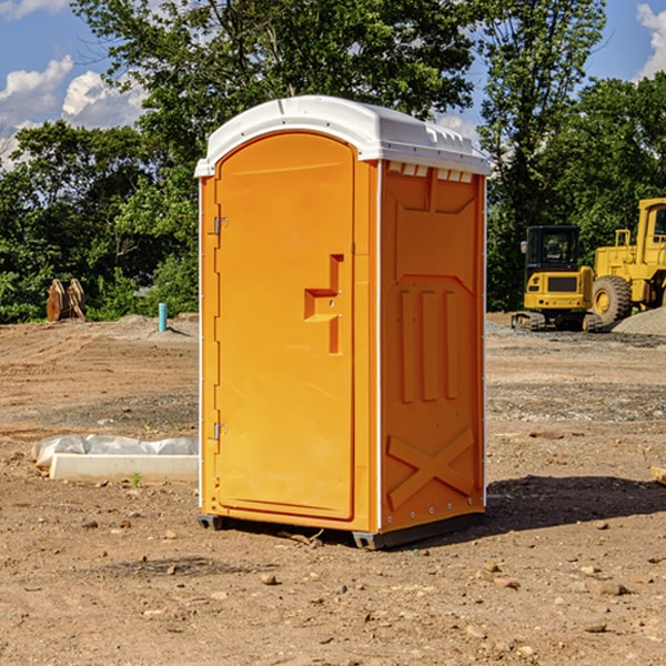 what is the cost difference between standard and deluxe portable toilet rentals in Russell